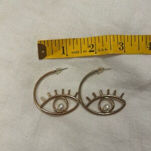 Gold Eye-Shaped Earrings with Pearl Accent